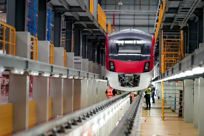 Railway Worker Goes Along Train